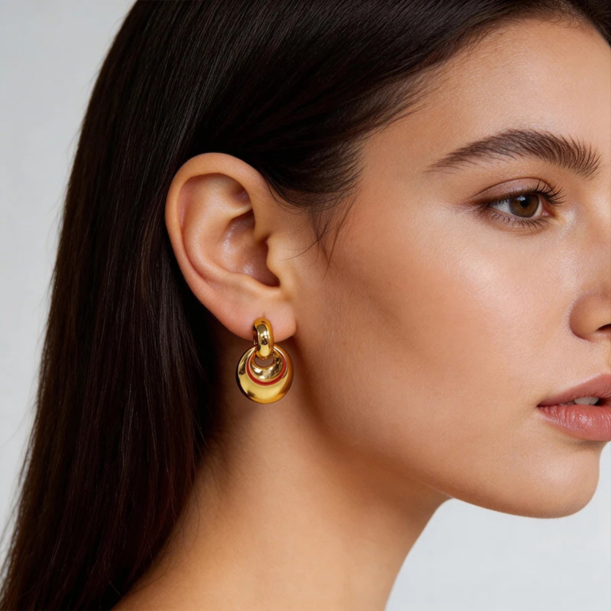 Sculpted Layer Gold Earrings worn in an editorial portrait