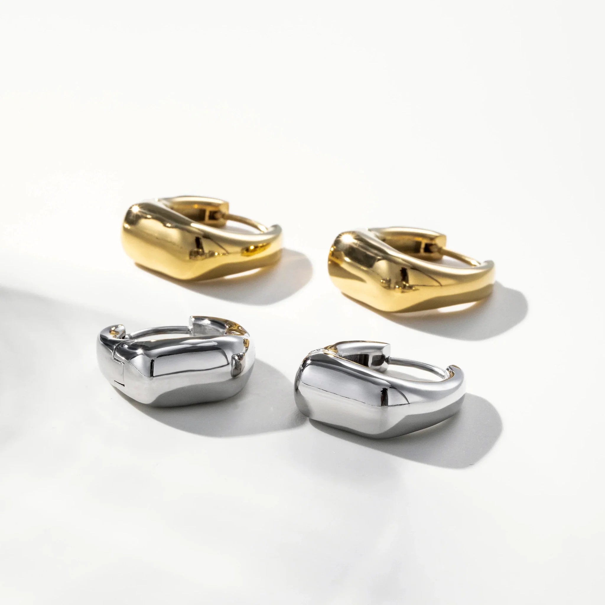 Vale Irregular Square Huggie Earrings worn in a close styling view