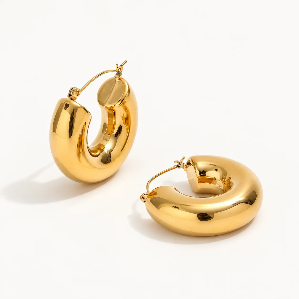 Gold-tone Orla sculpted double hoop earrings