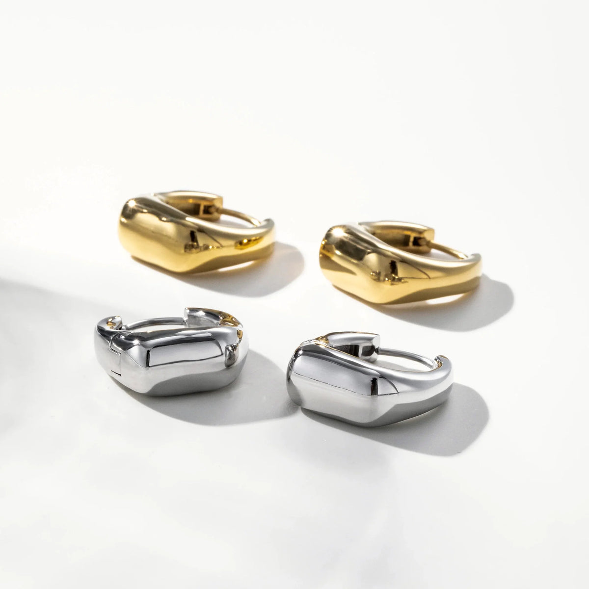 Vale Irregular Square Huggie Earrings worn in a close styling view