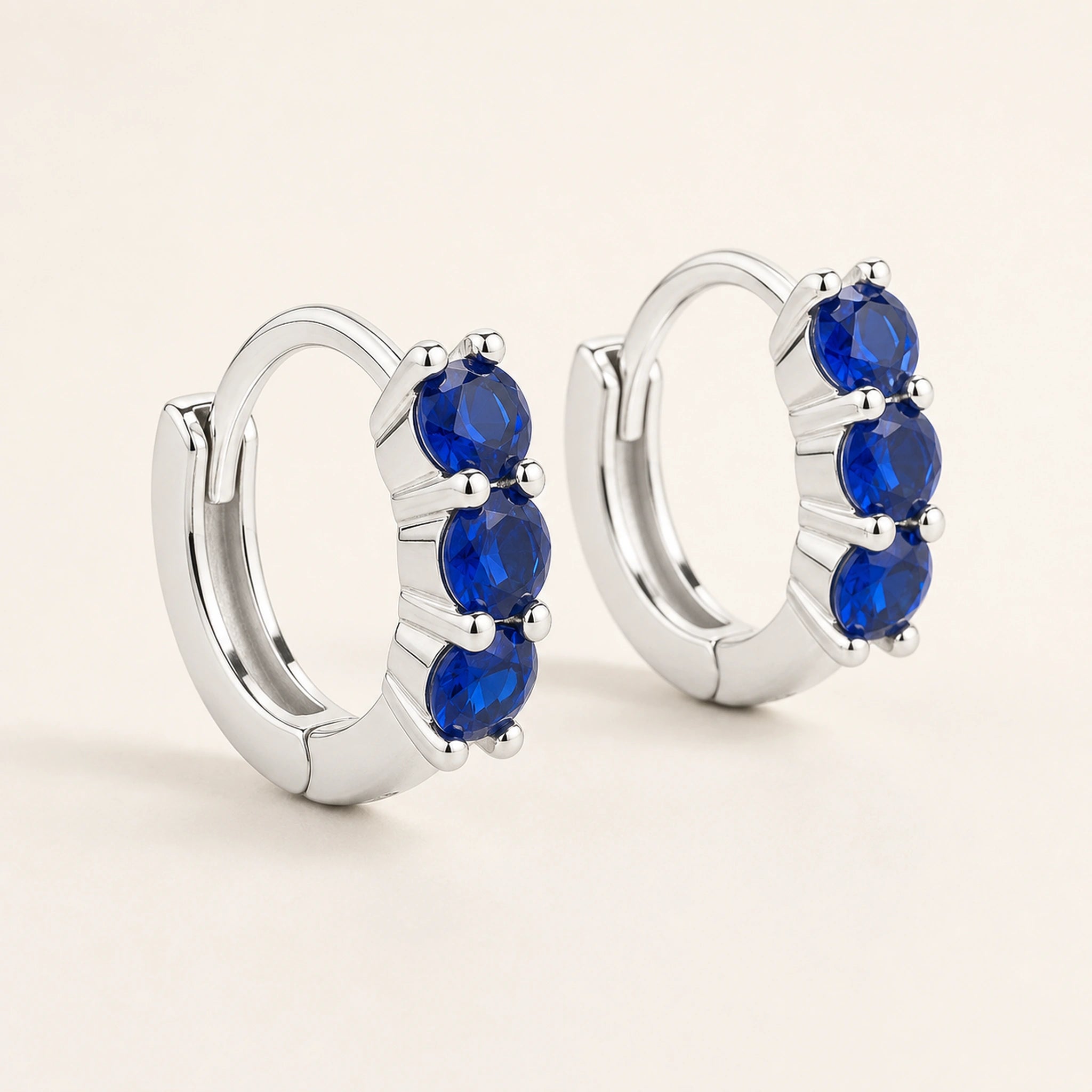 Celeste Blue Zircon Huggie Earrings – Sterling Silver